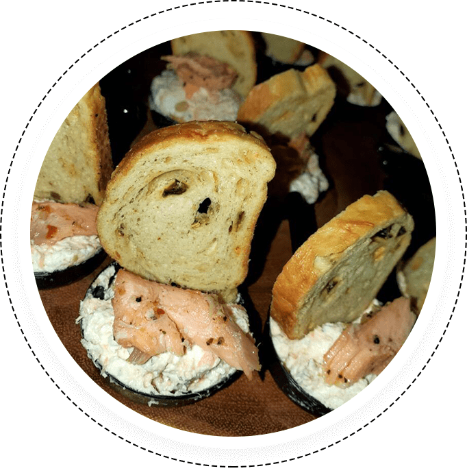 A plate of food with bread and salmon.